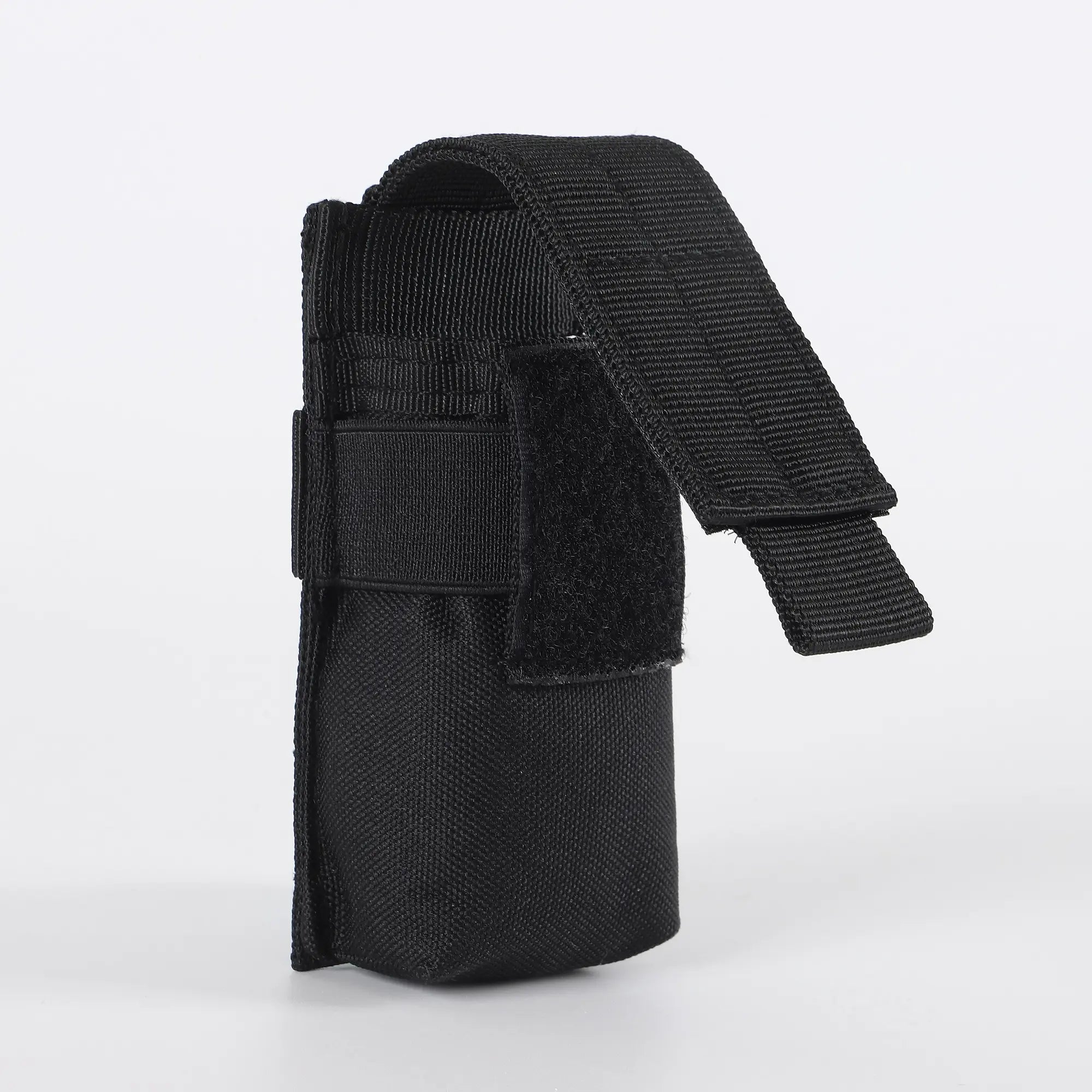 Black flashlight holder viewed from side with velcro open