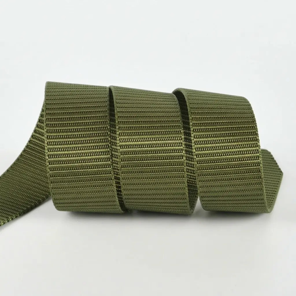 Green webbing strap on a white background