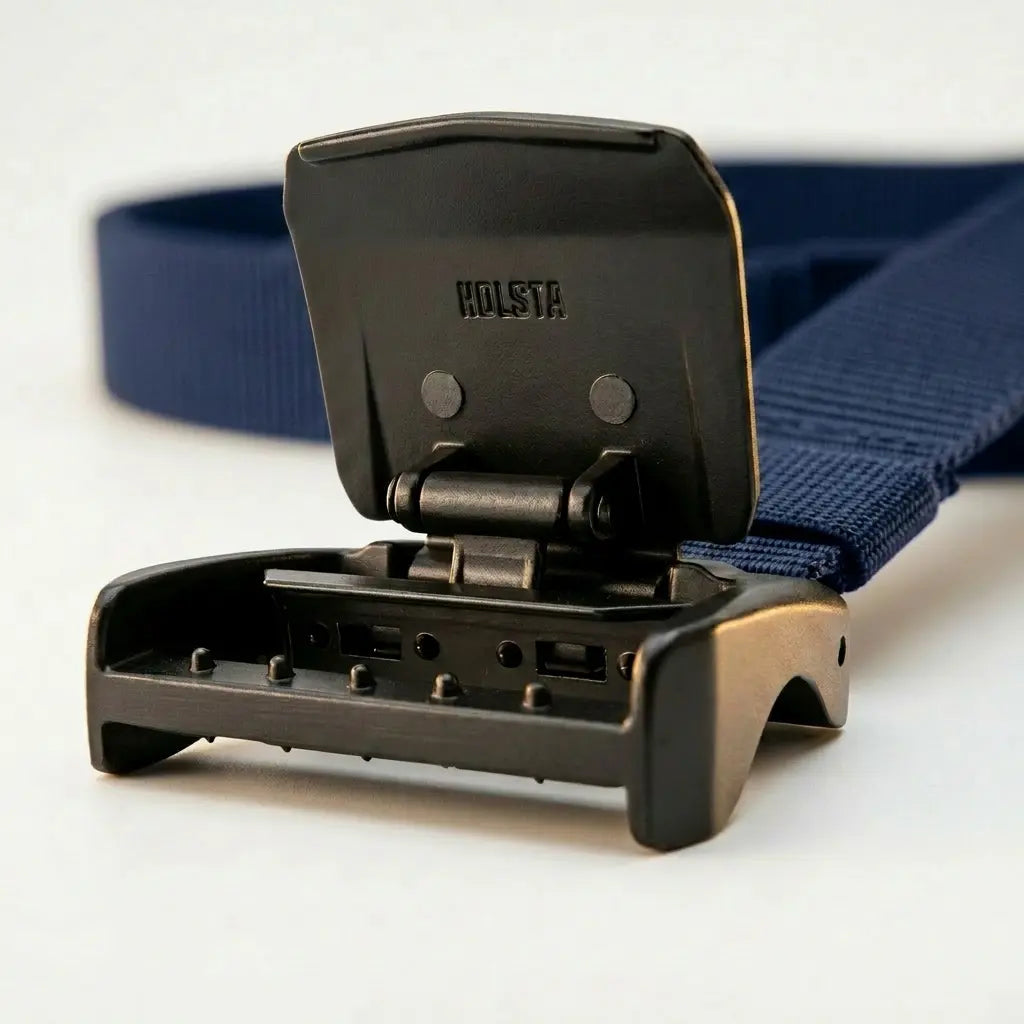 Black belt buckle with 'Holsta' branding and blue strap on a white background
