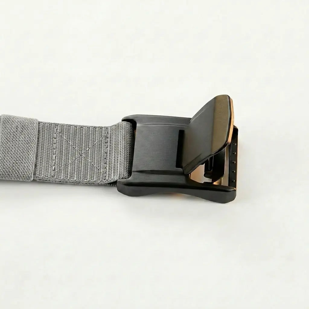 Gray belt with a black buckle on a light gray background