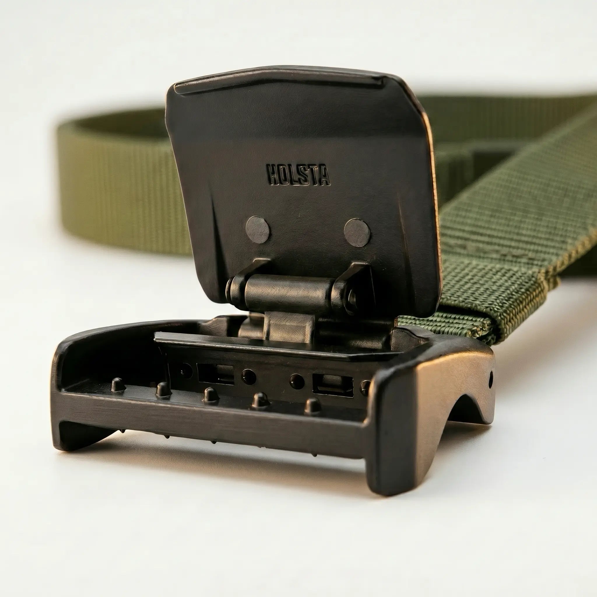 Green belt with a black buckle on a white background
