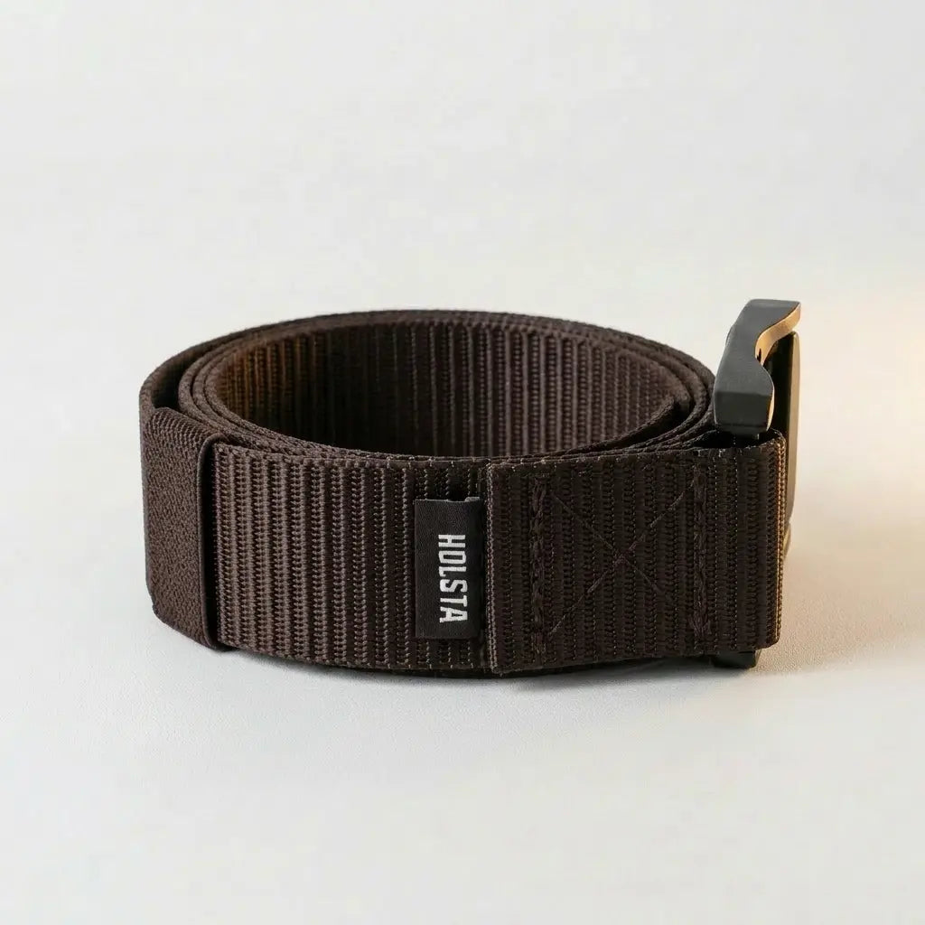 Dark brown belt with a metallic buckle on a light gray background
