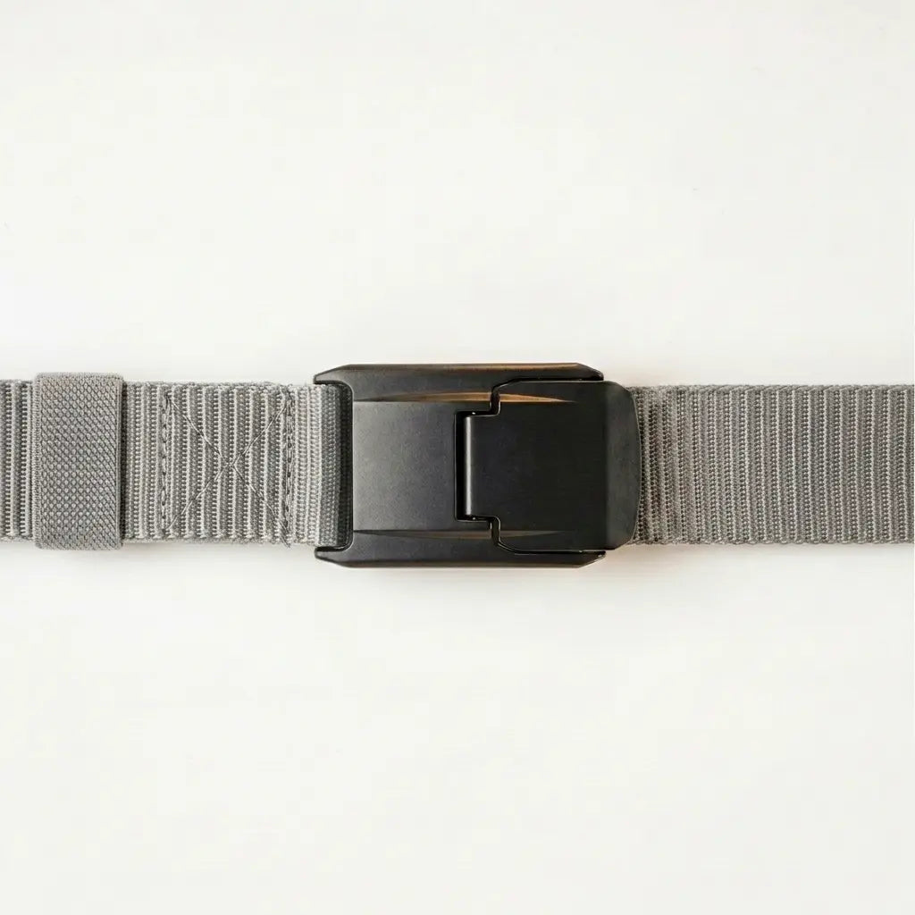 Gray belt with a black buckle on a light gray background