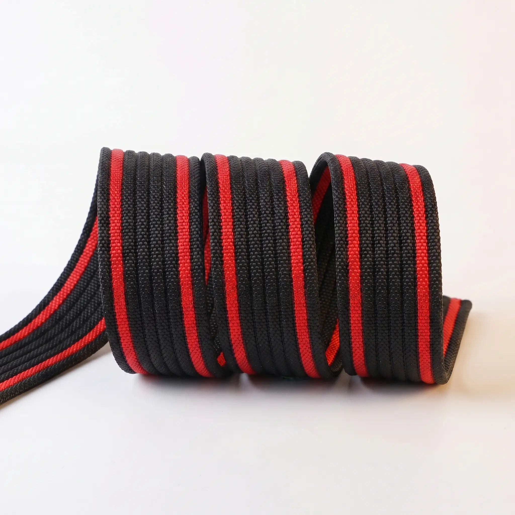 Black and red webbing on a white background