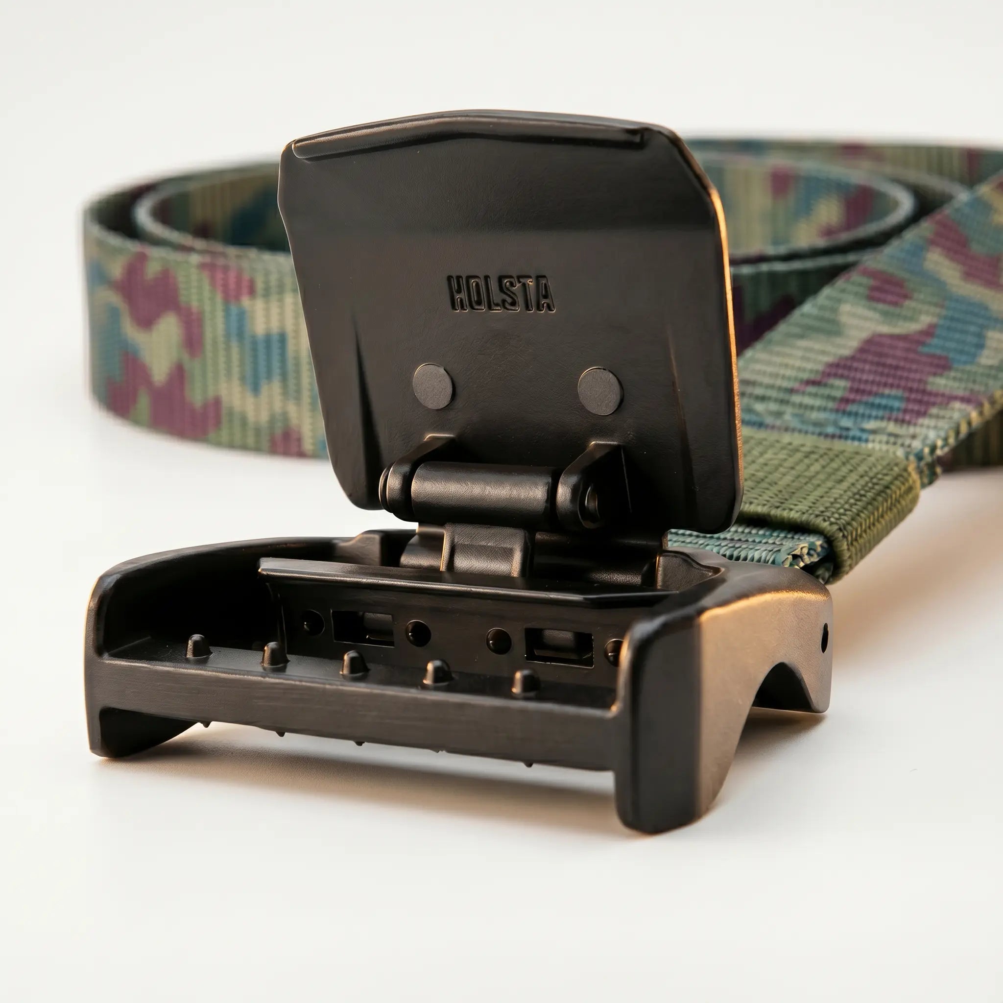 Camouflage belt with a black buckle on a white background